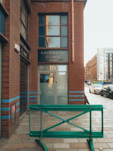 Exterior view of Cavendish Clinic entrance on a bustling city street.